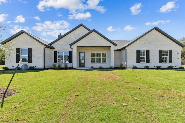 view of front of home with a front yard