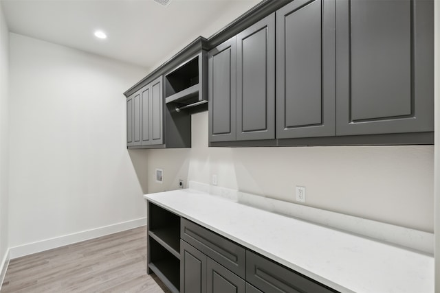 kitchen featuring light hardwood / wood-style flooring and gray cabinets