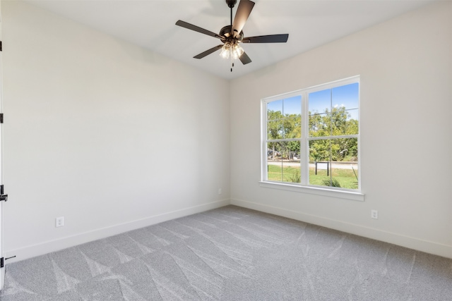 unfurnished room with carpet floors and ceiling fan