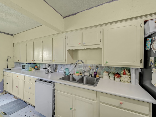 kitchen with white dishwasher, a textured ceiling, tasteful backsplash, and sink