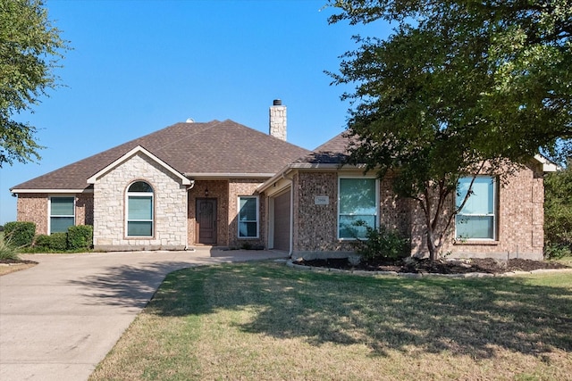 ranch-style house featuring roof with shingles, a front lawn, and a chimney