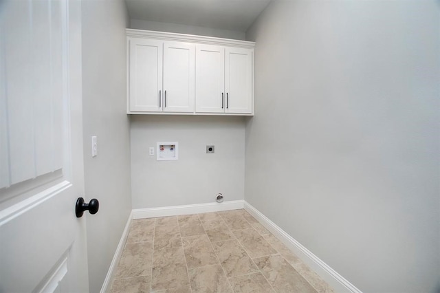 clothes washing area with hookup for a washing machine, electric dryer hookup, and cabinets