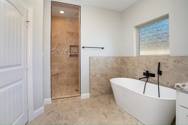 bathroom with vanity and plus walk in shower