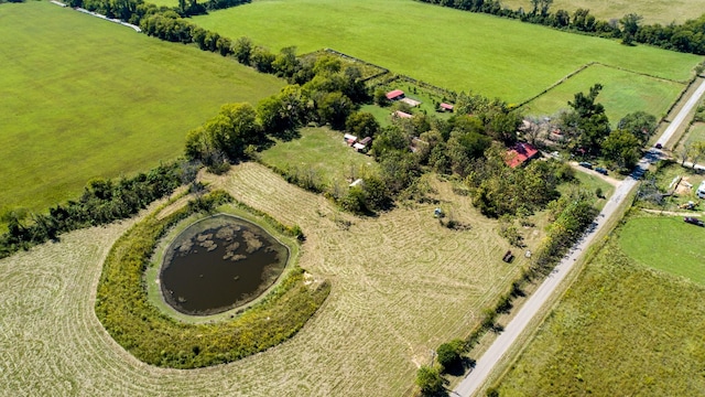 aerial view with a rural view and a water view