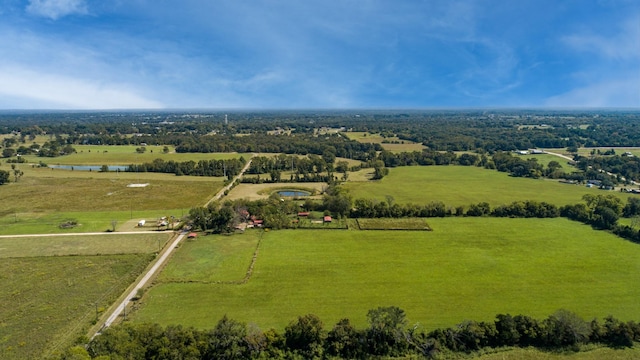 birds eye view of property featuring a rural view and a water view