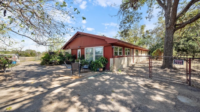 view of front of property featuring a patio area