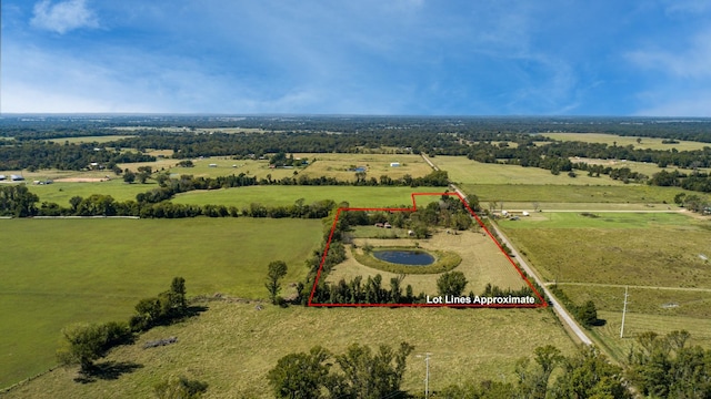 birds eye view of property featuring a rural view