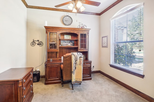 home office featuring ornamental molding, ceiling fan, light colored carpet, and a healthy amount of sunlight