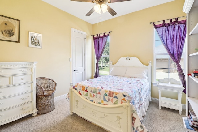 bedroom with ceiling fan and carpet flooring