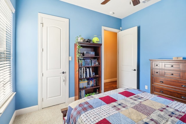 bedroom featuring ceiling fan and light colored carpet