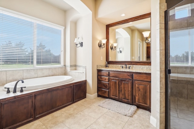 bathroom featuring vanity, separate shower and tub, and tile patterned floors