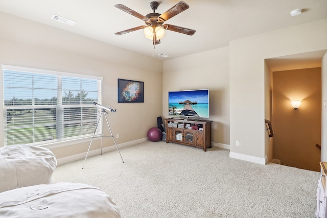 living room with light carpet and ceiling fan