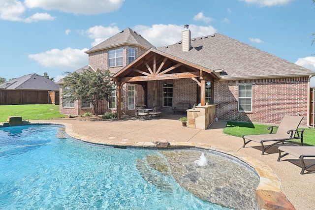 view of swimming pool featuring a lawn and a patio