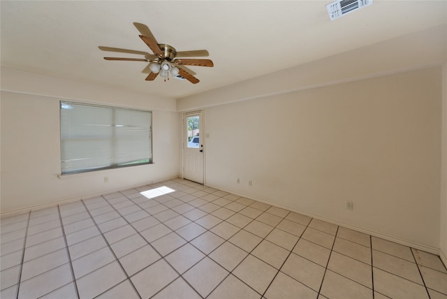 unfurnished room featuring ceiling fan and light tile patterned floors