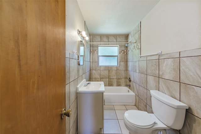 full bathroom with tile walls, tile patterned flooring, vanity, and toilet