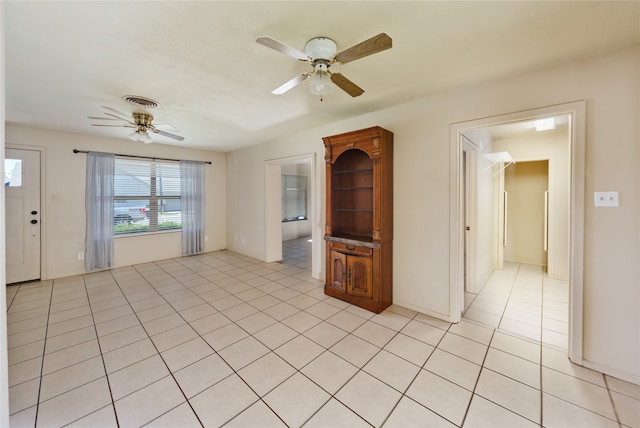 interior space featuring ceiling fan