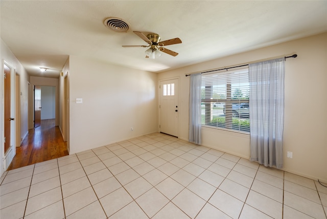 interior space with light wood-type flooring and ceiling fan