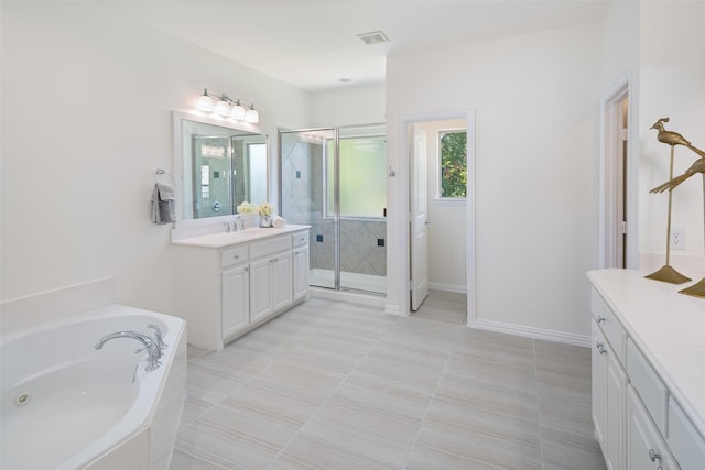 bathroom featuring vanity, tile patterned floors, and independent shower and bath