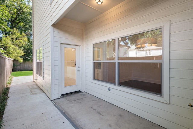 entrance to property featuring a patio