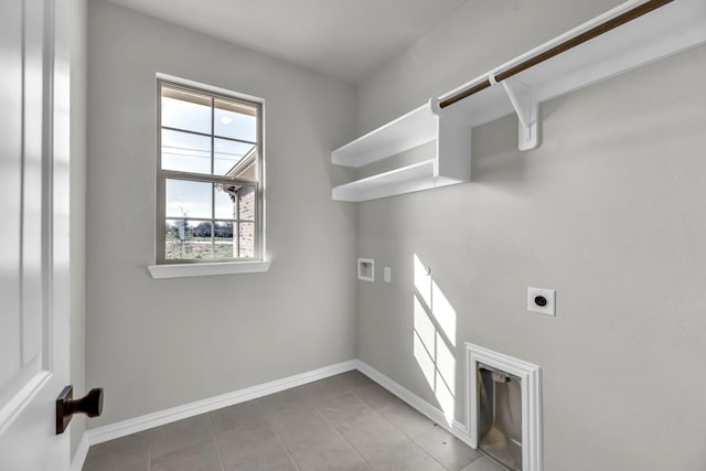 laundry room with hookup for an electric dryer, tile patterned floors, and washer hookup