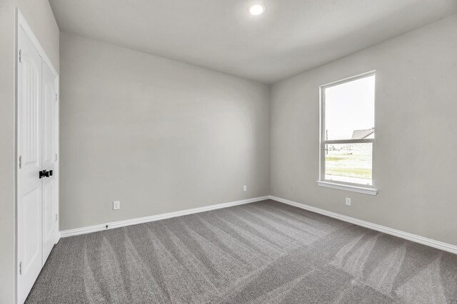 view of carpeted spare room