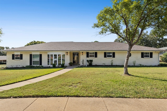 ranch-style house with a front lawn