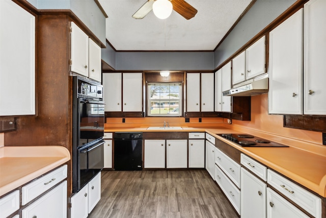 kitchen featuring ceiling fan, black appliances, dark hardwood / wood-style flooring, and white cabinetry