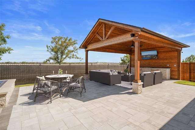 view of patio featuring a gazebo and an outdoor hangout area