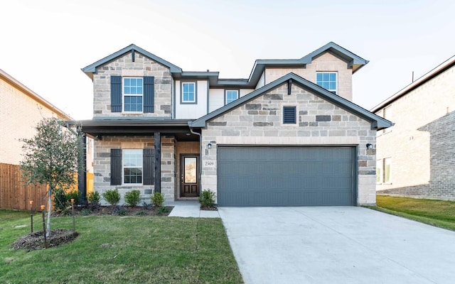 view of front of property featuring a garage and a front lawn