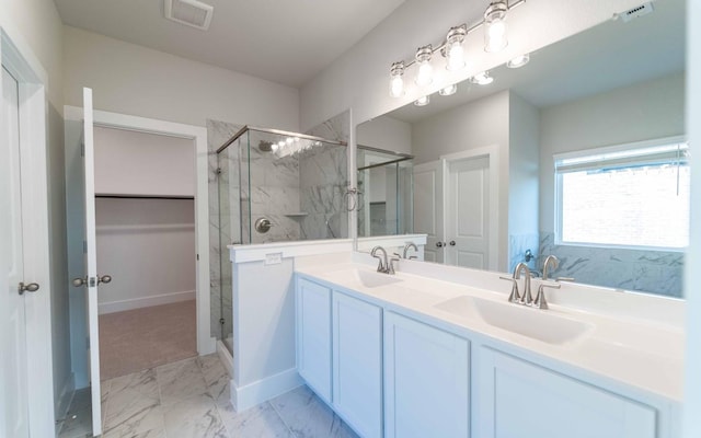 bathroom featuring vanity and walk in shower