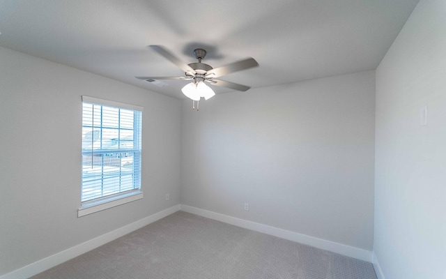 carpeted empty room with ceiling fan