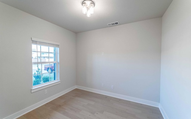 unfurnished room featuring light wood-type flooring