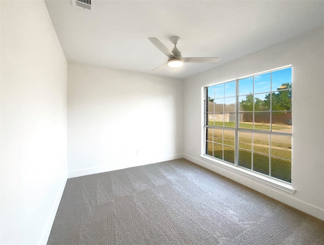 unfurnished room with ceiling fan and carpet floors