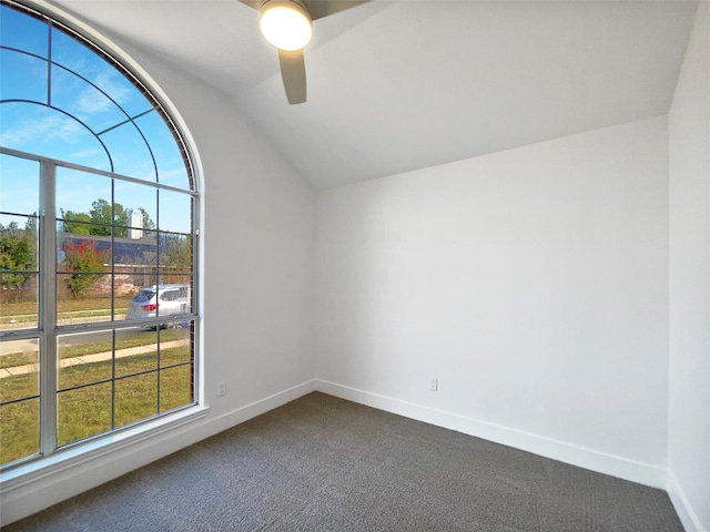 carpeted empty room featuring lofted ceiling and ceiling fan