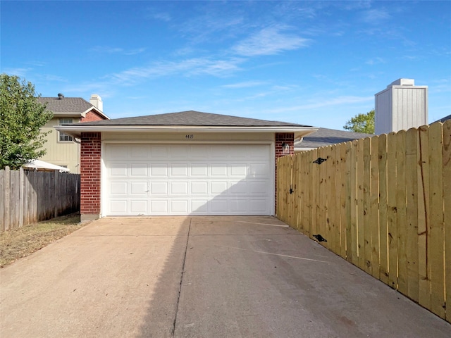 garage featuring wood walls