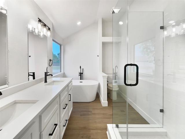 full bathroom with vanity, lofted ceiling, toilet, separate shower and tub, and hardwood / wood-style floors