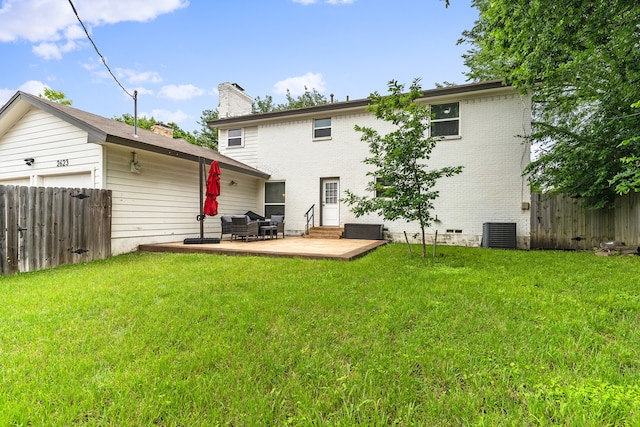 rear view of house with a lawn, a patio, and central air condition unit