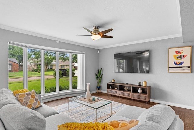 living room featuring crown molding, ceiling fan, and hardwood / wood-style flooring