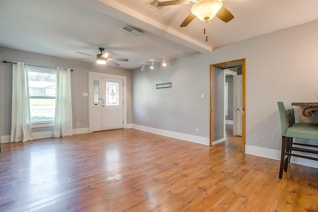 entrance foyer with light hardwood / wood-style floors and ceiling fan