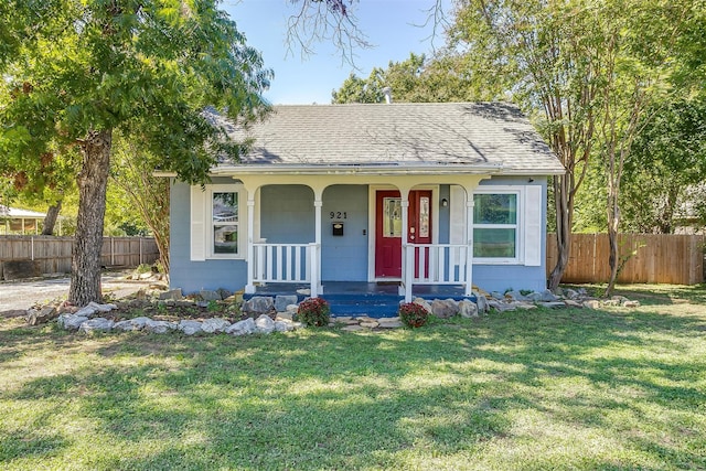 bungalow-style house with a porch and a front lawn