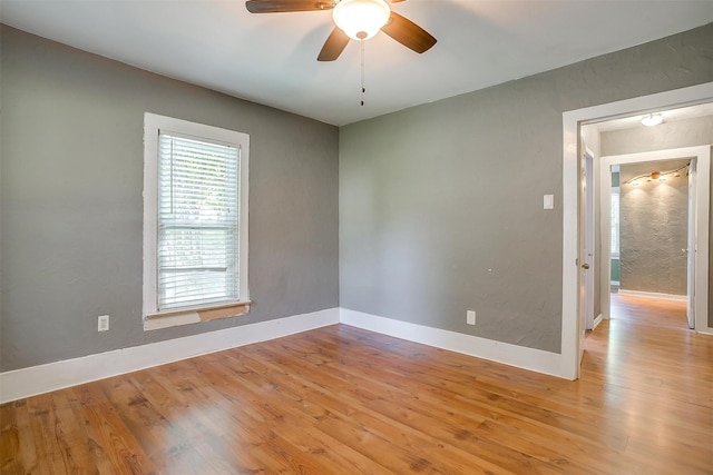 spare room featuring ceiling fan and light wood-type flooring