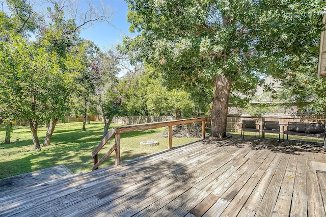 wooden terrace with a yard