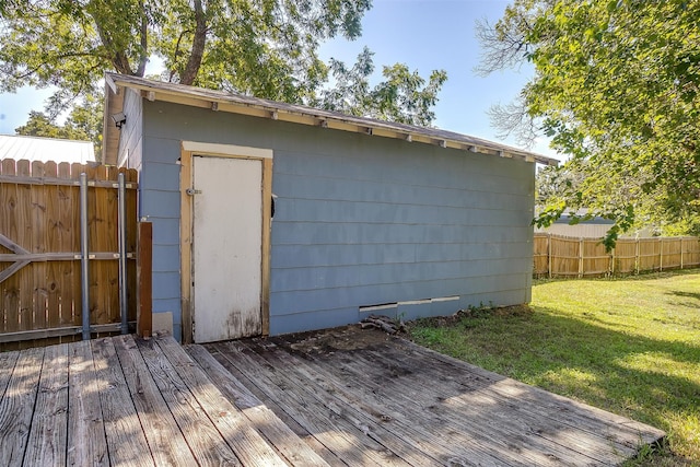 view of outbuilding featuring a yard