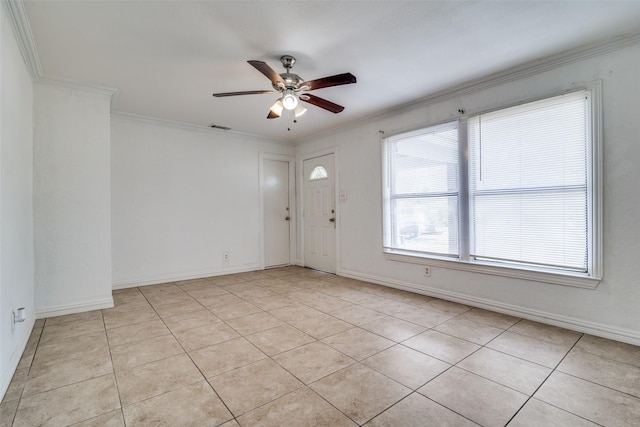 unfurnished room featuring ceiling fan, light tile patterned flooring, and crown molding