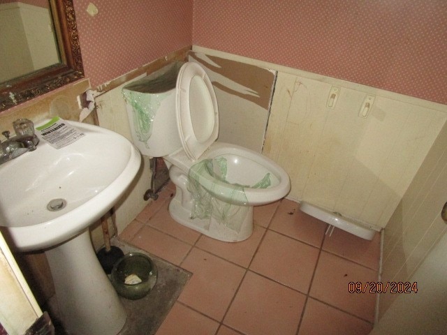 bathroom with tile patterned flooring and toilet