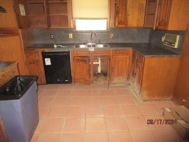 kitchen with light tile patterned floors, black dishwasher, backsplash, and sink