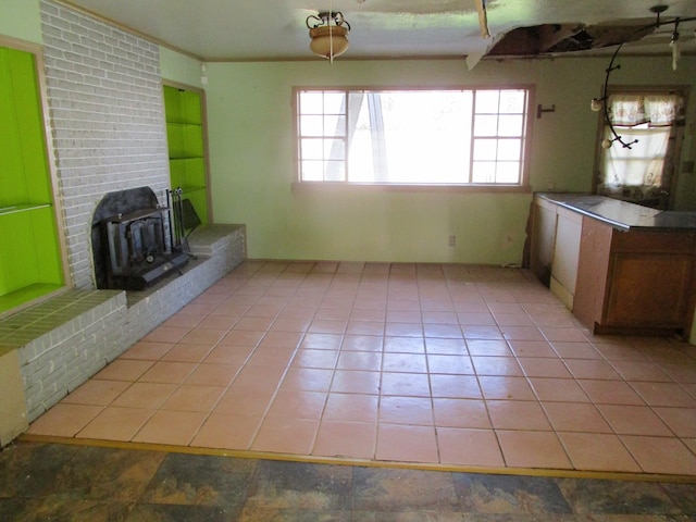 interior space with tile patterned flooring and a fireplace