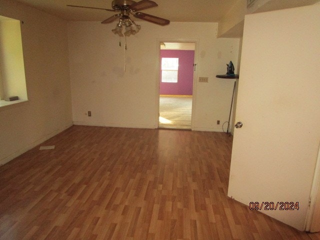 unfurnished room featuring ceiling fan and hardwood / wood-style flooring