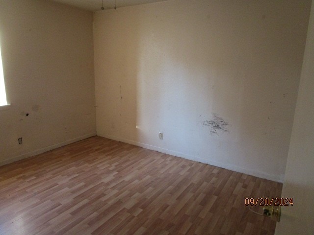 unfurnished room featuring light hardwood / wood-style flooring