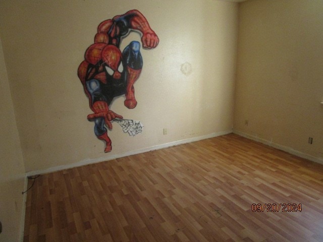 spare room featuring light hardwood / wood-style flooring